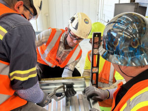 Group of workers collaborate on a custom build at PTL