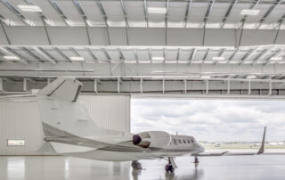 “Aircraft inside a Butler Manufacturing clearspan hangar, similar to the aviation facilities PTL Fabricators can construct using Butler systems.