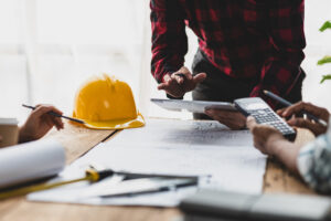 Brainstorming group of architects and engineers discuss building