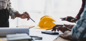 Brainstorming group of architects and engineers discuss building
