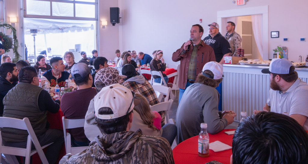 Jimmy Kent Wilson, Chris Gorell. and Phillip Holloway announce to employees at the 2025 PTL Fabricators Christmas Party plans to transition to an ESOP in January 2026.
