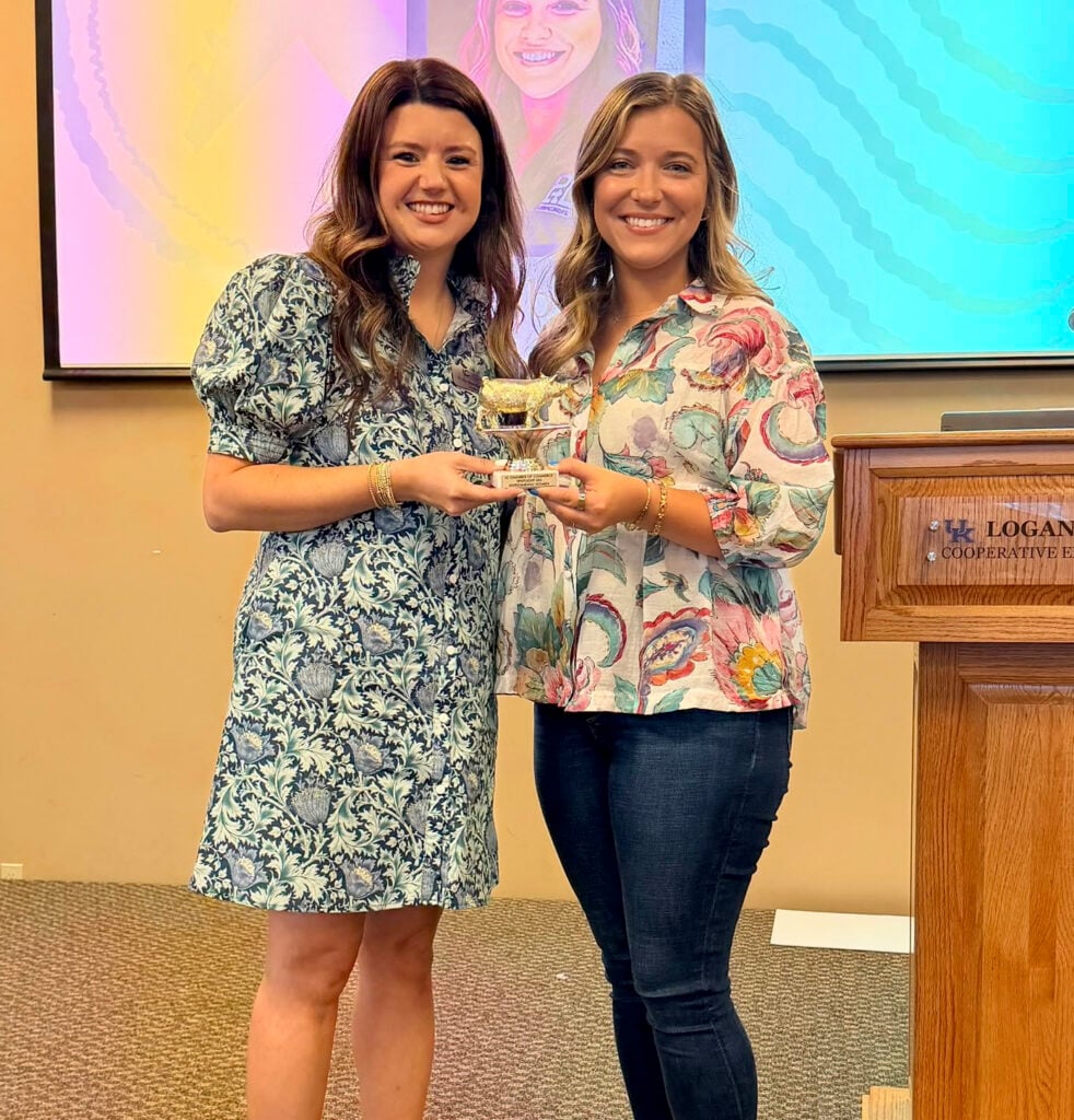 Logan County Chamber of Commerce President Polly Steenbergen presents the "Spotlight Outstanding Women" award to Tiffany Blick, Executive Administrator of PTL Fabricators.